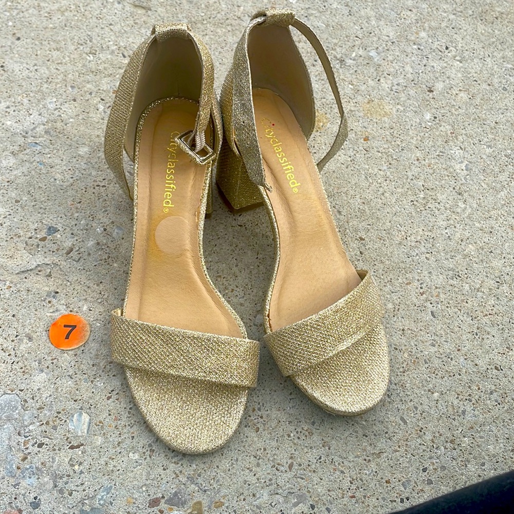 These golden shimmery shoes are  for sale